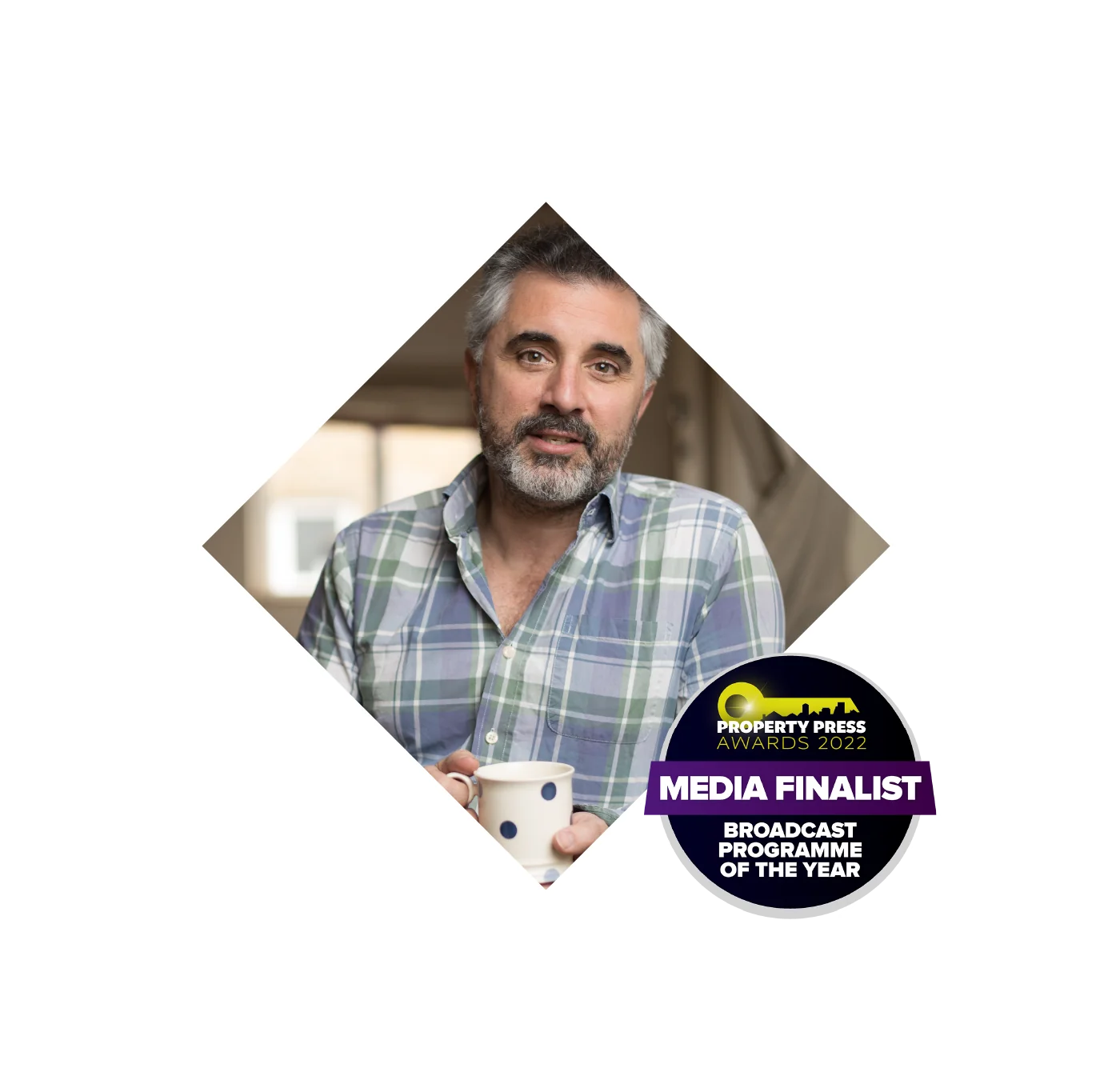 Charlie Lamdin with a mug, Property Press Media Awards finalist badge